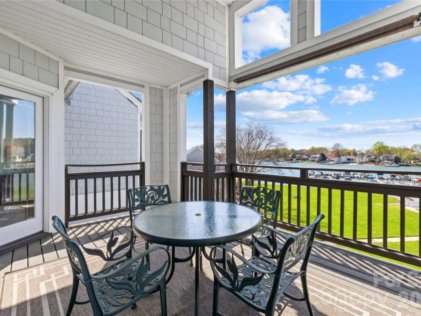 18700 Nautical Drive, Cornelius, NC 28031.  MLS# CAR4357308, YatesRealty ID 14763. HUGE outside covered deck with lake views!