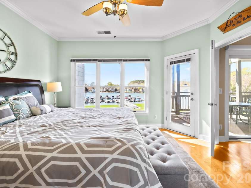 18700 Nautical Drive, Cornelius, NC 28031.  MLS# CAR4357308, YatesRealty ID 14763. Primary Bedroom with lake views and hardwood floors! 
