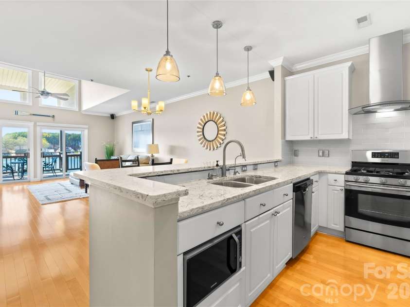 18700 Nautical Drive, Cornelius, NC 28031.  MLS# CAR4357308, YatesRealty ID 14763. Updated Kitchen with stainless steel appliances, granite countertops, tiled backsplash and an updraft hood! 