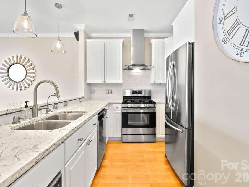 18700 Nautical Drive, Cornelius, NC 28031.  MLS# CAR4357308, YatesRealty ID 14763. Updated Kitchen with stainless steel appliances, granite countertops, tiled backsplash and an updraft hood!