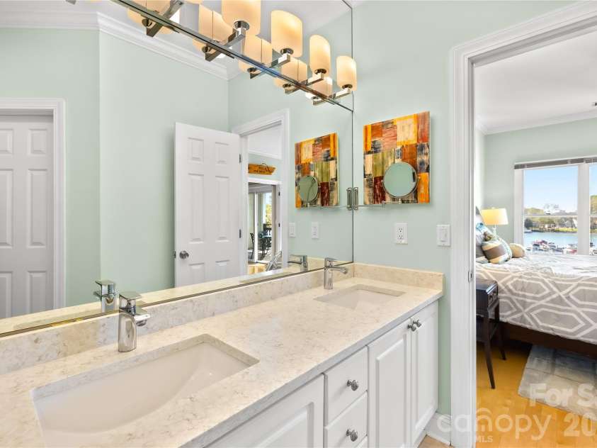 18700 Nautical Drive, Cornelius, NC 28031.  MLS# CAR4357308, YatesRealty ID 14763. Updated Primary Bathroom with granite countertops and dual vanities!