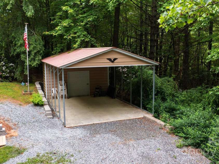 350 Stagecoach Road, Zirconia, NC 28790.  MLS# CAR4262854, YatesRealty ID 14765. Carport with storage