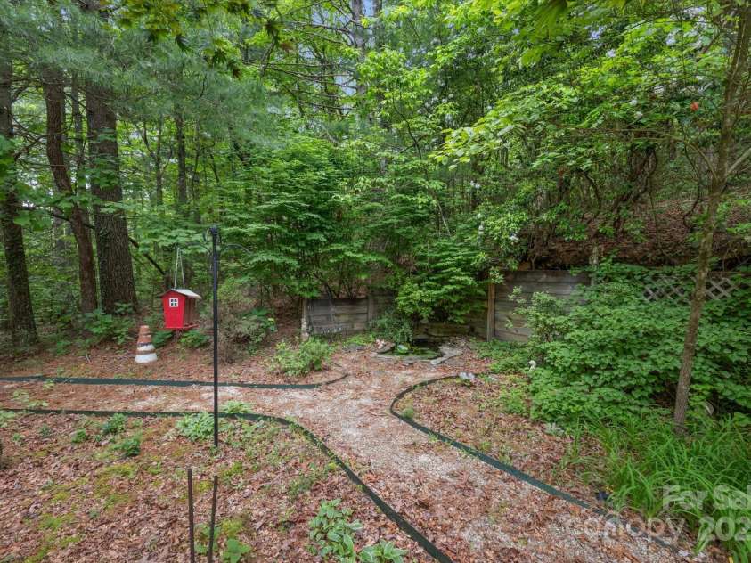 350 Stagecoach Road, Zirconia, NC 28790.  MLS# CAR4262854, YatesRealty ID 14765. Garden area off kitchen