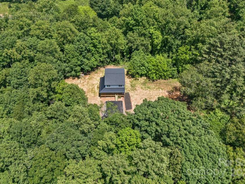 440 Old Buckeye Cove Road, Swannanoa, NC 28778.  MLS# CAR4262695, YatesRealty ID 14766. Complete privacy and surrounded by woods!
