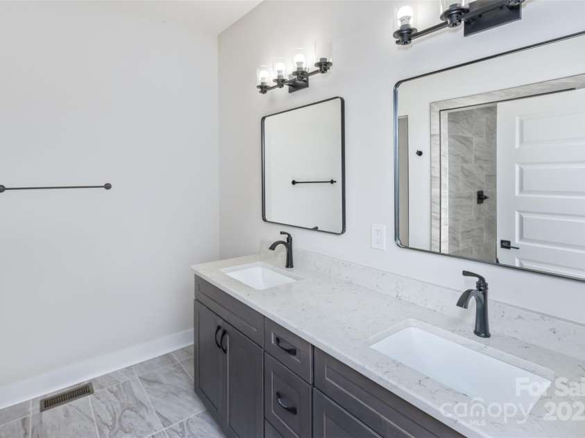 440 Old Buckeye Cove Road, Swannanoa, NC 28778.  MLS# CAR4262695, YatesRealty ID 14766. Dual vanity with great lighting and more granite!