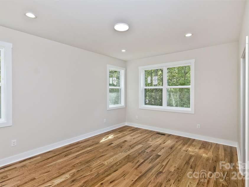 440 Old Buckeye Cove Road, Swannanoa, NC 28778.  MLS# CAR4262695, YatesRealty ID 14766. Entry point of the main floor primary bedroom.