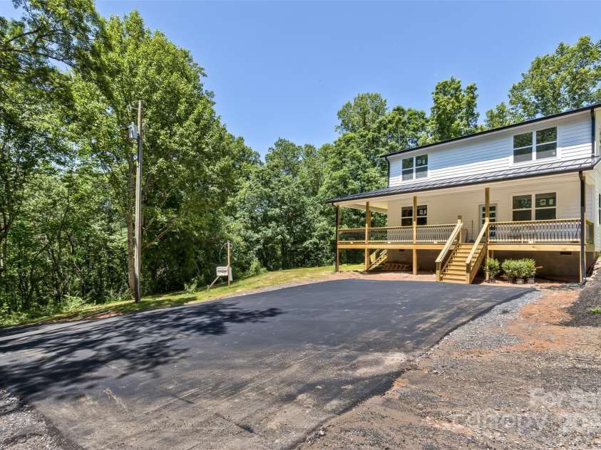 440 Old Buckeye Cove Road, Swannanoa, NC 28778.  MLS# CAR4262695, YatesRealty ID 14766. Plenty of parking for 4+ cars.