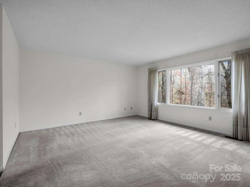 31 Hunting Country Trail, Tryon, NC 28782.  MLS# CAR4240091, YatesRealty ID 14777. Primary Bedroom on Main Level.