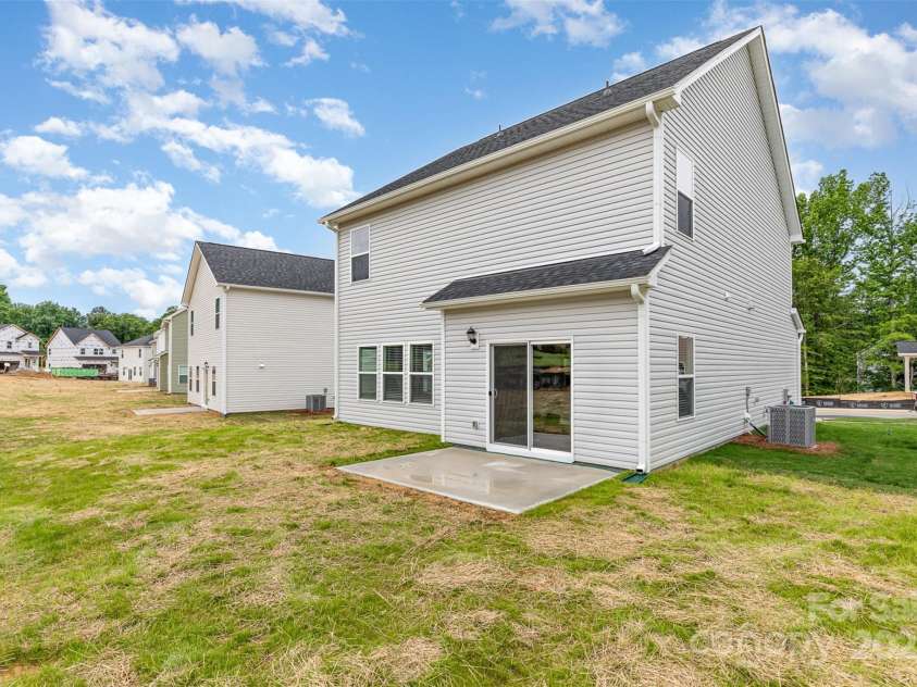 2023 Sadler Woods Lane, Charlotte, NC 28214.  MLS# CAR4263129, YatesRealty ID 14781. Back view of home. Representational Photo.
