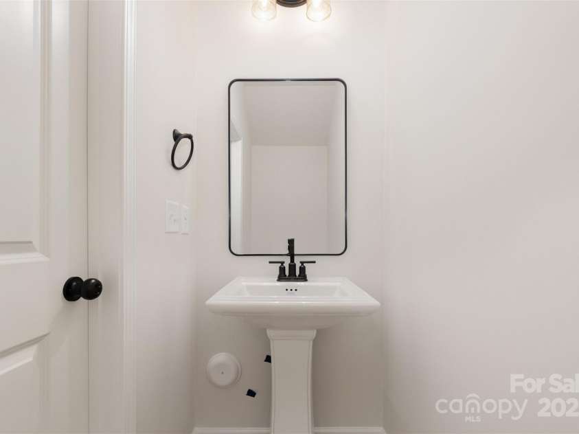 2023 Sadler Woods Lane, Charlotte, NC 28214.  MLS# CAR4263129, YatesRealty ID 14781. Half bathroom. Representational Photo.