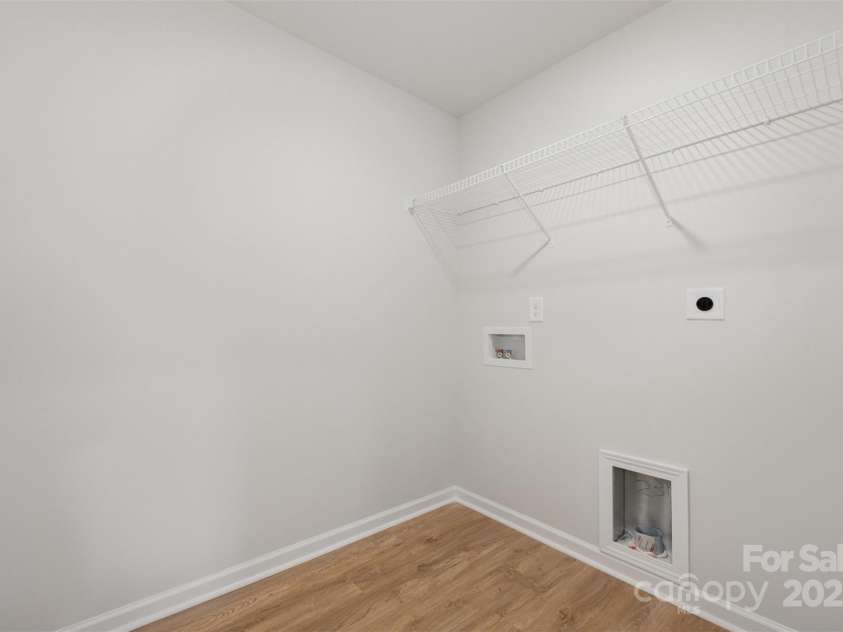2023 Sadler Woods Lane, Charlotte, NC 28214.  MLS# CAR4263129, YatesRealty ID 14781. Laundry room. Representational Photo.