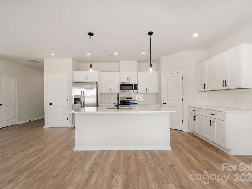 2023 Sadler Woods Lane, Charlotte, NC 28214.  MLS# CAR4263129, YatesRealty ID 14781. Spacious Kitchen w/ side serving area. Representational Photo.