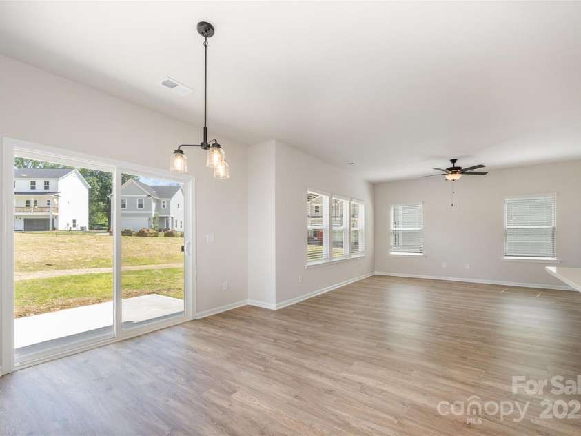 2023 Sadler Woods Lane, Charlotte, NC 28214.  MLS# CAR4263129, YatesRealty ID 14781. SPC flooring throughout 1st floor. Representational Photo.