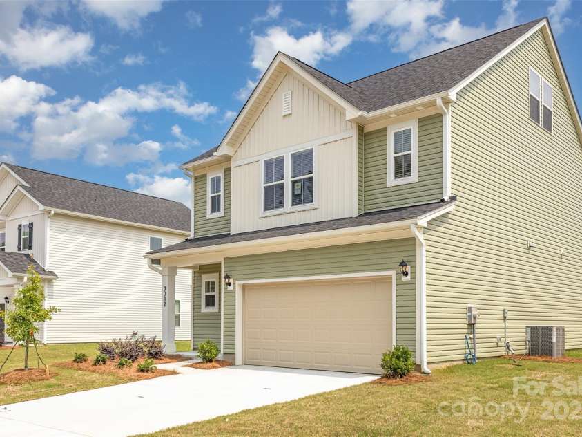 2031 Sadler Woods Lane, Charlotte, NC 28214.  MLS# CAR4263133, YatesRealty ID 14783. Double-car garage & concrete driveway. Representational Photo.