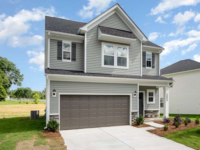 2035 Sadler Woods Lane, Charlotte, NC 28214.  MLS# CAR4263134, YatesRealty ID 14784. Double-car garage & concrete driveway. Representative Photo.