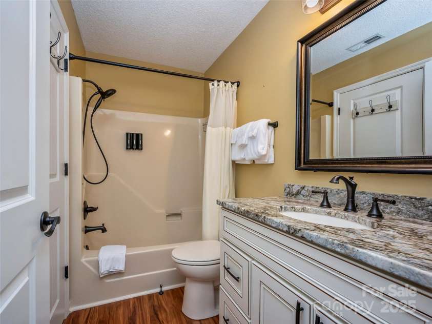 128 Quail Run Court, Lake Lure, NC 28746.  MLS# CAR4262944, YatesRealty ID 14789. 