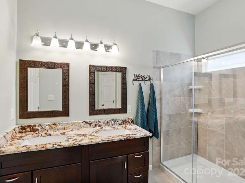 4612 Saxonbury Way, Charlotte, NC 28269.  MLS# CAR4263076, YatesRealty ID 14791. Primary Bath with updated cabinetry & shower!