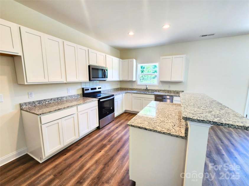 2300 Grayson Parkway, Monroe, NC 28110.  MLS# CAR4263227, YatesRealty ID 14792. Gleaming White Cabinets and Granite