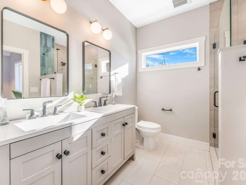 67 Crestfield Avenue, Asheville, NC 28804.  MLS# CAR4351848, YatesRealty ID 14793. Double vanity primary bath