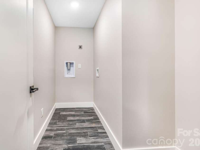 67 Crestfield Avenue, Asheville, NC 28804.  MLS# CAR4351848, YatesRealty ID 14793. Laundry room upstairs