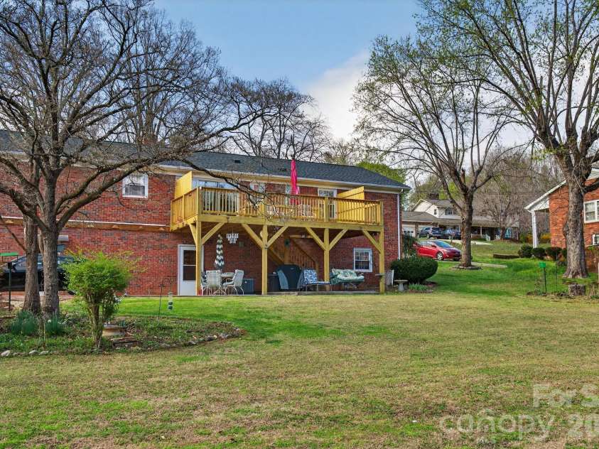 708 Wilmore Street, Lenoir, NC 28645.  MLS# CAR4360264, YatesRealty ID 14812. View of the deck and back yard
