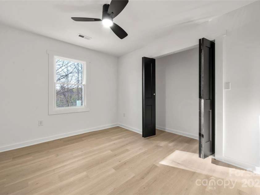 2120 Green Oak Drive, Shelby, NC 28152.  MLS# CAR4240877, YatesRealty ID 14818. Spacious secondary bedroom with ceiling fan.