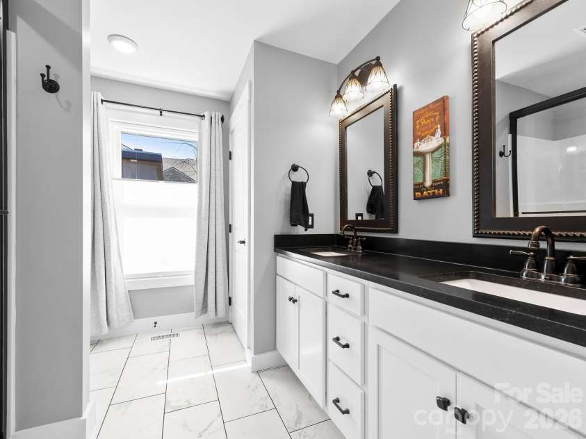 482 Booker Street, Asheville, NC 28803.  MLS# CAR4362039, YatesRealty ID 14819. Double vanity in the primary bathroom