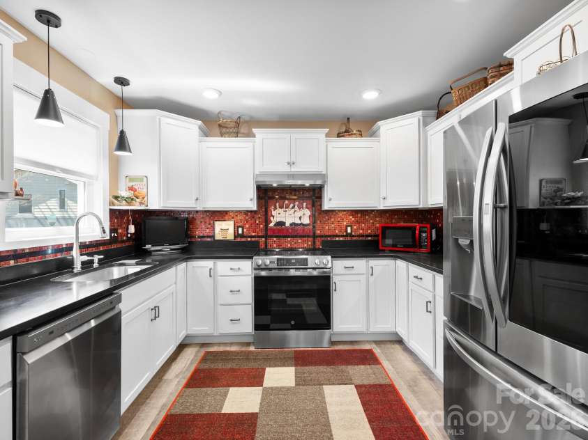 482 Booker Street, Asheville, NC 28803.  MLS# CAR4362039, YatesRealty ID 14819. Electric stove, but it is plumbed for a propane stove too. 