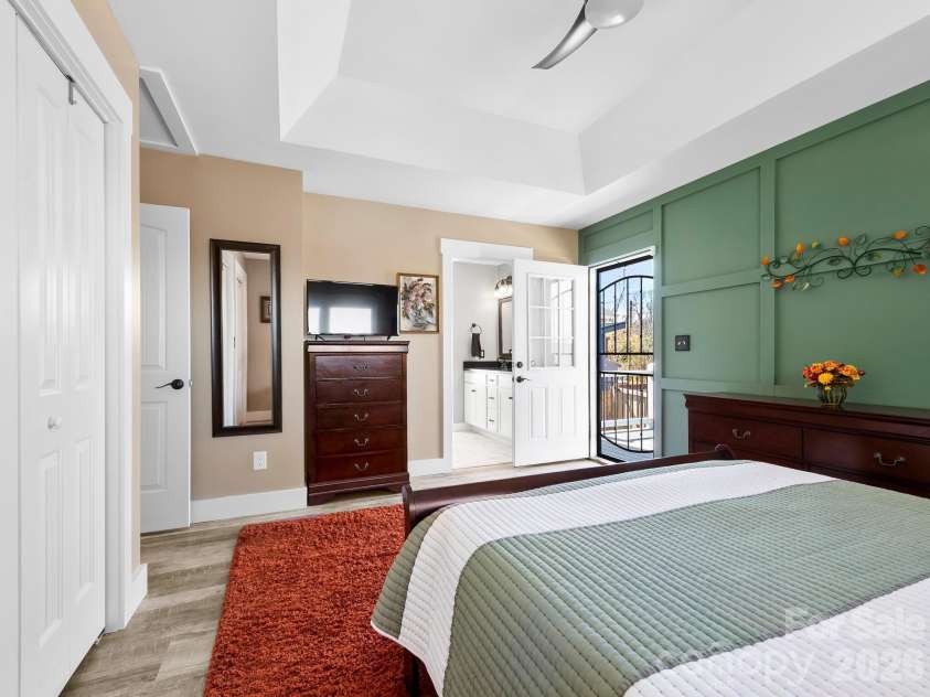 482 Booker Street, Asheville, NC 28803.  MLS# CAR4362039, YatesRealty ID 14819. Primary bedroom with access to the back deck