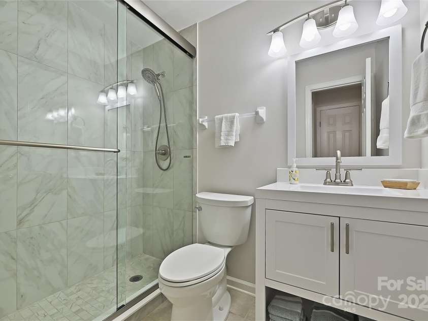 19901 Henderson Road, Cornelius, NC 28031.  MLS# CAR4306229, YatesRealty ID 14825. Beautiful renovated Primary bath!