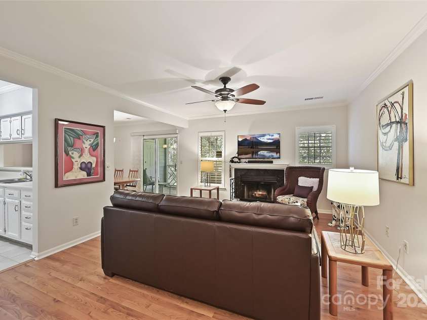 19901 Henderson Road, Cornelius, NC 28031.  MLS# CAR4306229, YatesRealty ID 14825. Laminate Flooring graces the Great Room and Dining Room