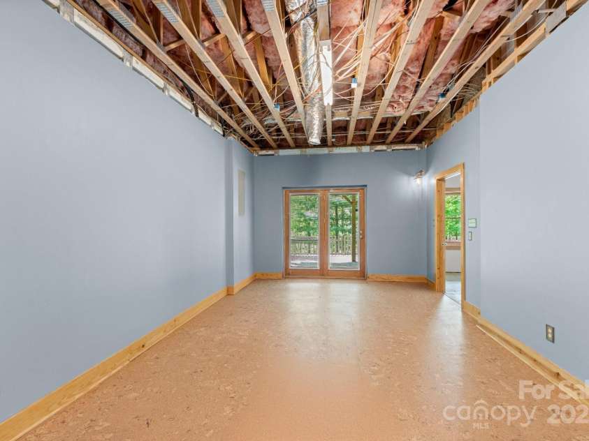 132 Vacation Way, Millers Creek, NC 28651.  MLS# CAR4254466, YatesRealty ID 14827. 3rd bedroom will be completed by 8/31/25 sheetrocked by professional contractor