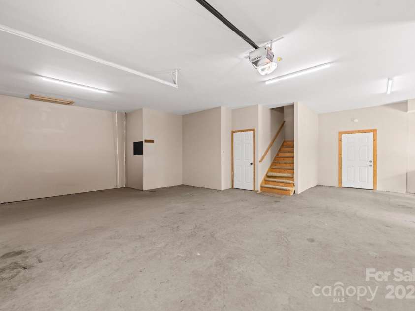 132 Vacation Way, Millers Creek, NC 28651.  MLS# CAR4254466, YatesRealty ID 14827. Garage w/extra area for ATV's and a utility sink for dirty days