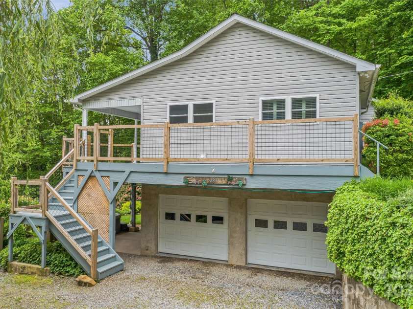 283 Grapevine Cove, Waynesville, NC 28785.  MLS# CAR4260835, YatesRealty ID 14836. 2 car attached garage with lower driveway