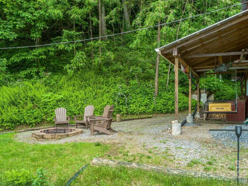 283 Grapevine Cove, Waynesville, NC 28785.  MLS# CAR4260835, YatesRealty ID 14836. Firepit area off 