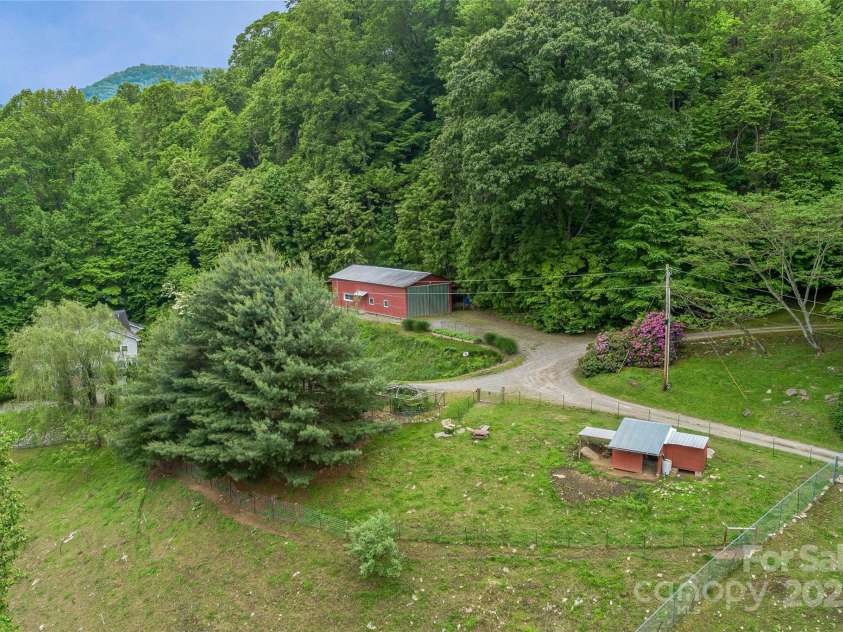 283 Grapevine Cove, Waynesville, NC 28785.  MLS# CAR4260835, YatesRealty ID 14836. Large barn/RV Storage holds a unique surprise...