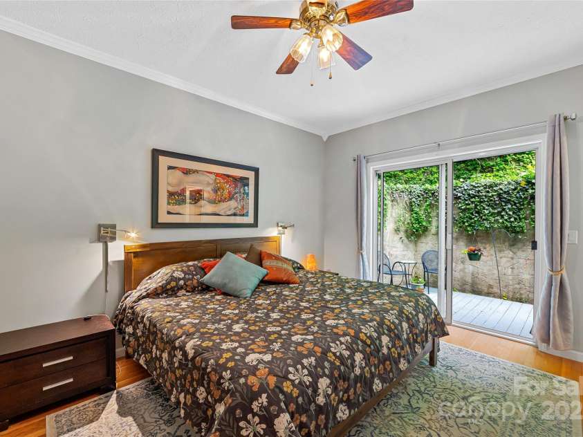 283 Grapevine Cove, Waynesville, NC 28785.  MLS# CAR4260835, YatesRealty ID 14836. Primary Bedroom with private patio