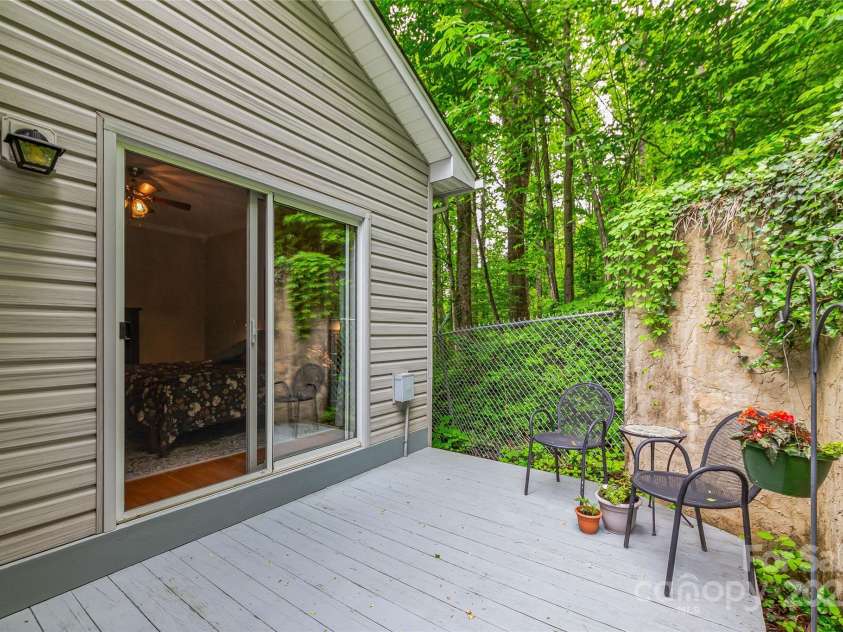 283 Grapevine Cove, Waynesville, NC 28785.  MLS# CAR4260835, YatesRealty ID 14836. Private patio connects to primary bedroom