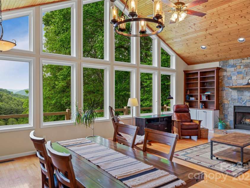 283 Grapevine Cove, Waynesville, NC 28785.  MLS# CAR4260835, YatesRealty ID 14836. Wall  of windows to let nature in