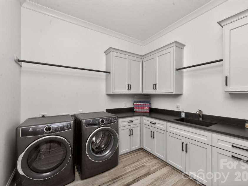 8008 Skye Lochs Drive, Waxhaw, NC 28173.  MLS# CAR4367926, YatesRealty ID 14845. Main level laundry room