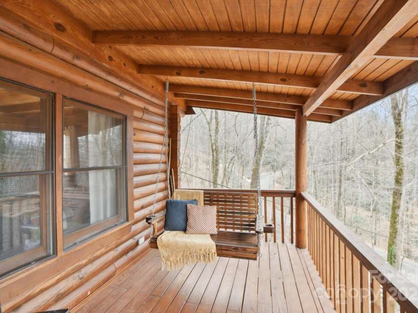 217 Chalet Road, Lake Lure, NC 28746.  MLS# CAR4232804, YatesRealty ID 14846. Front Deck Swing