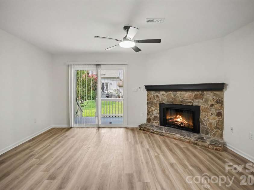 100 Willow Run Drive, Gastonia, NC 28056.  MLS# CAR4414074, YatesRealty ID 14849. Living area with stone fireplace