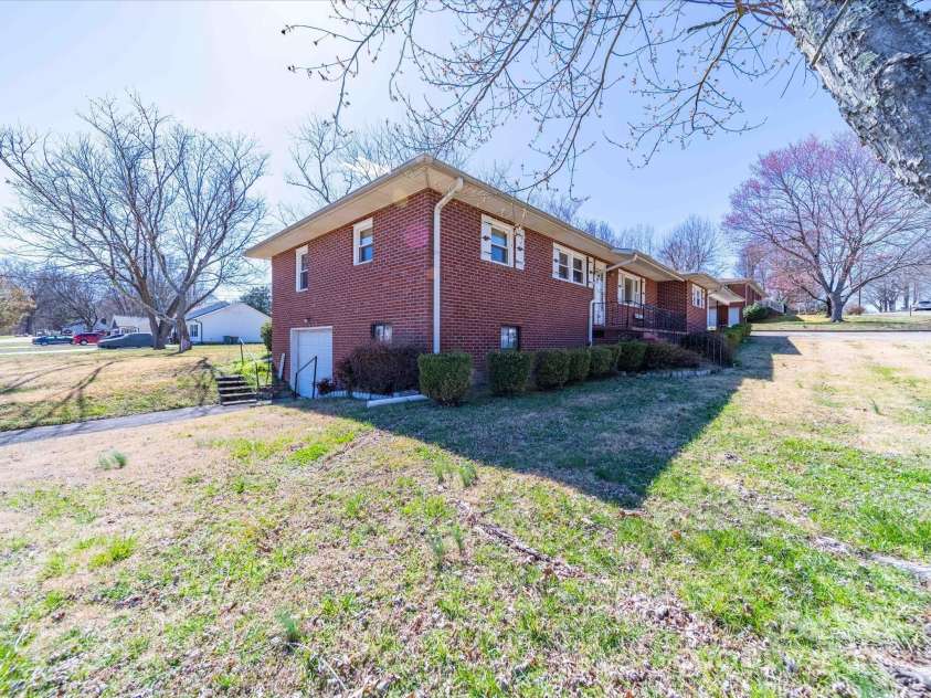 2310 Clay Street, Kannapolis, NC 28083.  MLS# CAR4231335, YatesRealty ID 14850. Left side of house with view of garage