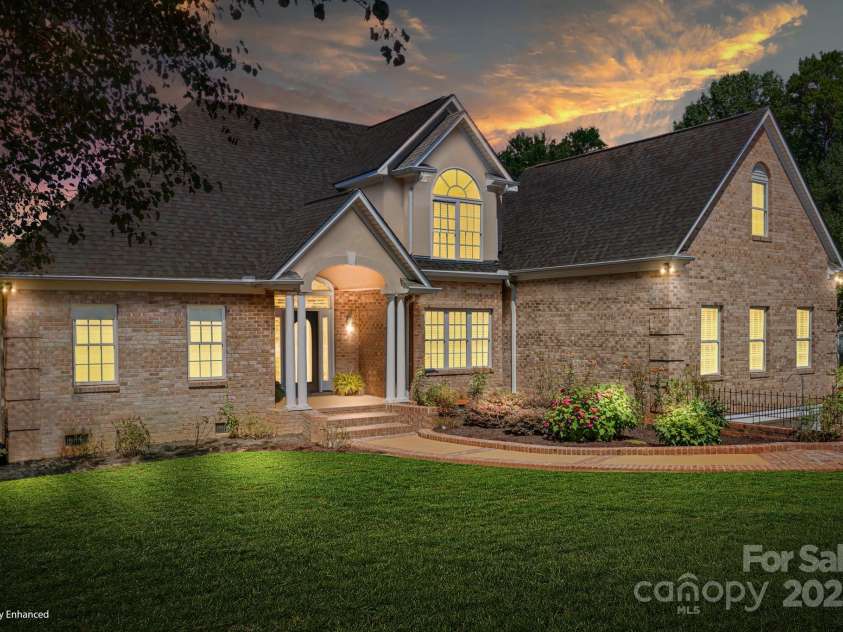 126 Emerald Drive, Mooresville, NC 28117.  MLS# CAR4224232, YatesRealty ID 14855. Frontyard twilight