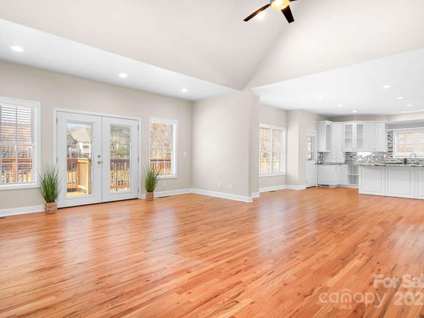 126 Emerald Drive, Mooresville, NC 28117.  MLS# CAR4224232, YatesRealty ID 14855. Large Living Room with Vaulted Ceilings opens to the Back Deck opens to the Kitchen
