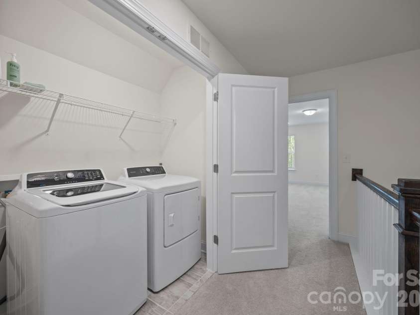 3950 Rothwood Lane, Harrisburg, NC 28075.  MLS# CAR4367827, YatesRealty ID 14857. Upstairs laundry