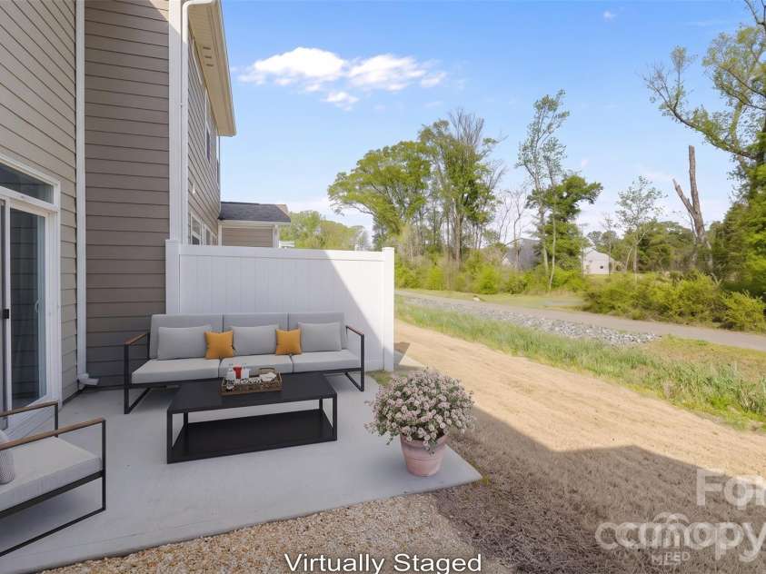 3950 Rothwood Lane, Harrisburg, NC 28075.  MLS# CAR4367827, YatesRealty ID 14857. Virtually staged back patio