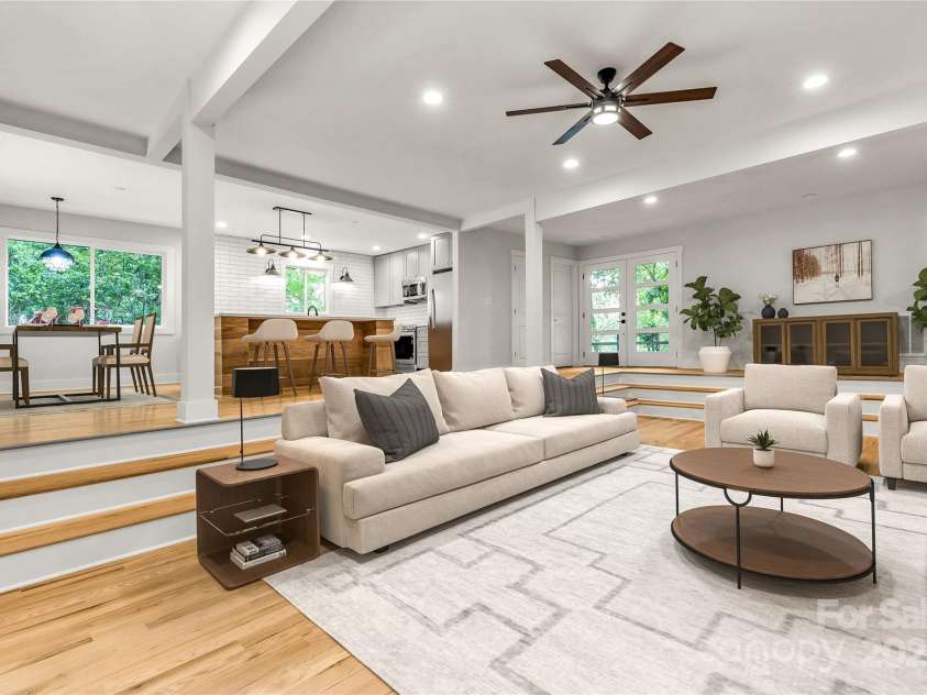 16137 Tana Tea Circle, Tega Cay, SC 29708.  MLS# CAR4227926, YatesRealty ID 14860. Living room with custom hardwood floors. *Virtually staged