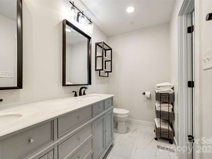 16137 Tana Tea Circle, Tega Cay, SC 29708.  MLS# CAR4227926, YatesRealty ID 14860. Primary Bathroom with dual sinks and tile shower