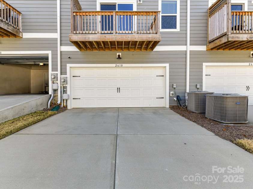 2610 Greenmarket Drive, Charlotte, NC 28217.  MLS# CAR4233387, YatesRealty ID 14864. Exterior back view of garage and driveway
